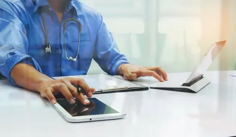 Cash and stethoscope representing healthcare expenses